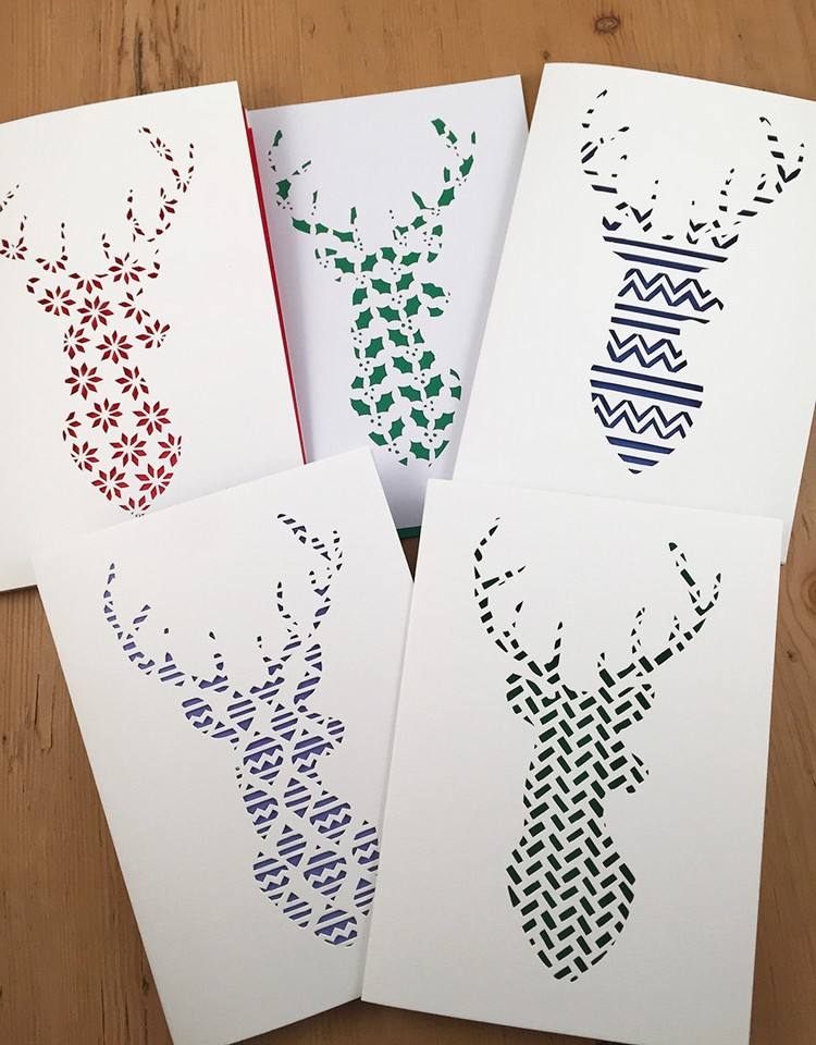 drotárske vianočné pohľadnice s papierovými rezanými motívmi sobov