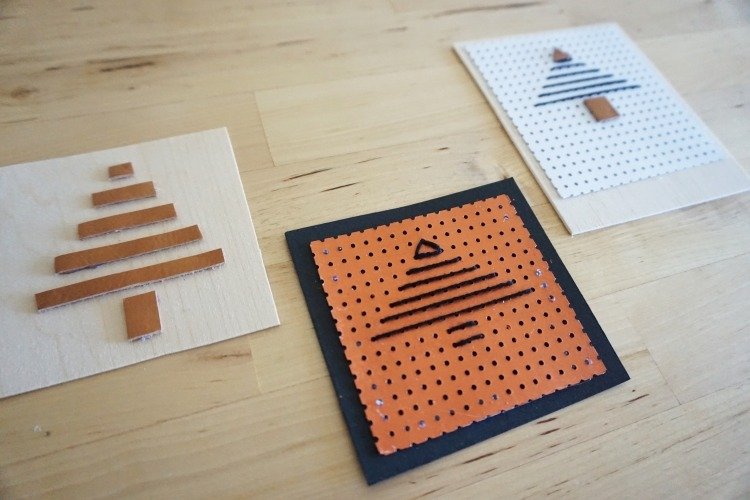 Vyrobte si kreatívne karty z jednoduchých materiálov vytvorte si vlastné vianočné pohľadnice-nápady-jednoduché-vianočné stromčeky-abstraktné-perforovaný-papier-kartón