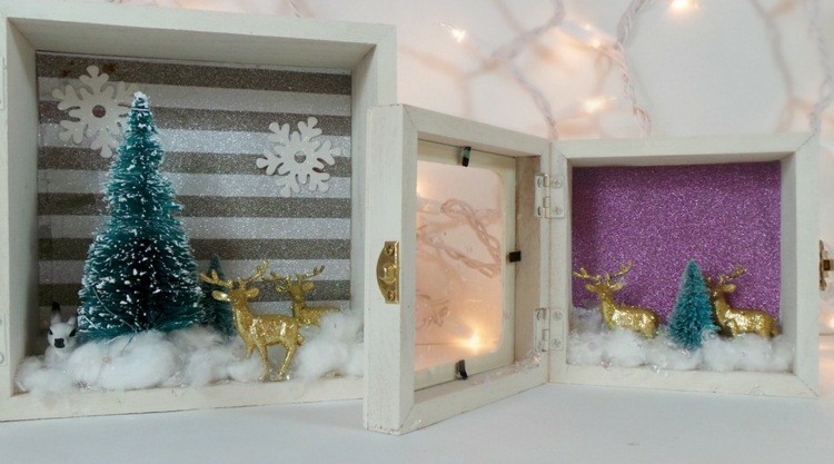 Zimná krajina v čajovej truhle so zlatými jeleňmi