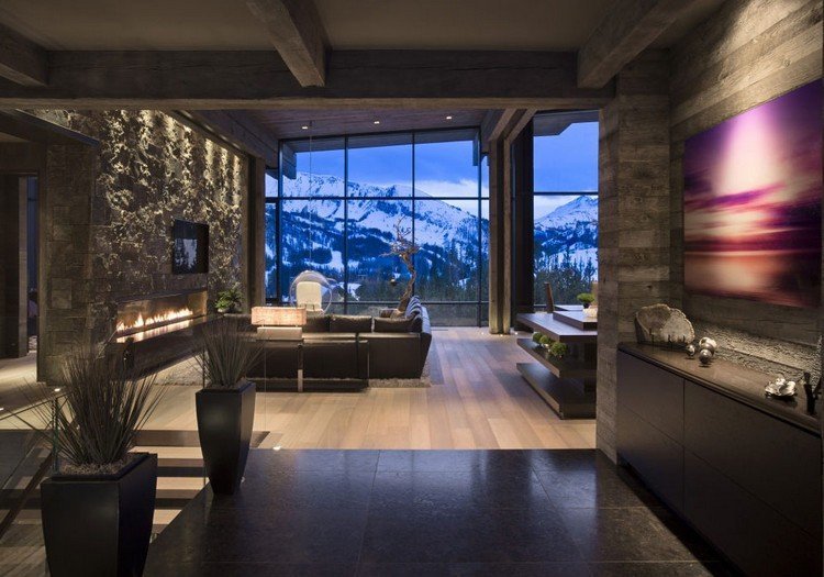 Obývacia izba-sivá-prírodný kameň-stena-kožená sedačka-tmavá podlaha