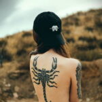 Photo of a scorpion tattoo on the back 01/16/2021 №0042 -scorpion back tattoo-