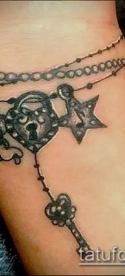 صورة لسوار الوشم (قيمة) - مثال على تصميم وشم مثير للاهتمام - 033