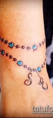 صورة لسوار الوشم (قيمة) - مثال على تصميم وشم مثير للاهتمام - 027