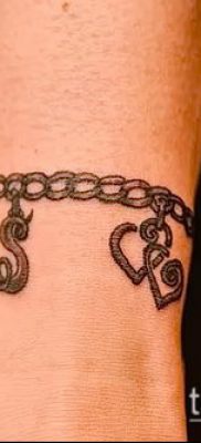 صورة لسوار الوشم (قيمة) - مثال على تصميم وشم مثير للاهتمام - 019