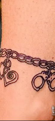 صورة لسوار الوشم (قيمة) - مثال على تصميم وشم مثير للاهتمام - 008