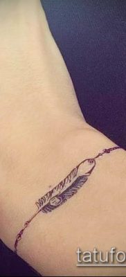 صورة سوار الوشم (القيمة) - مثال على تصميم وشم مثير للاهتمام - 004