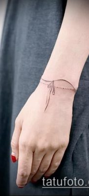 صورة لسوار الوشم (قيمة) - مثال على تصميم وشم مثير للاهتمام - 002