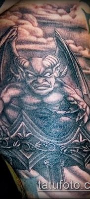 Fotó egy vízköpő tetoválásról (jelentése) - példa egy érdekes tetoválási tervre - 031