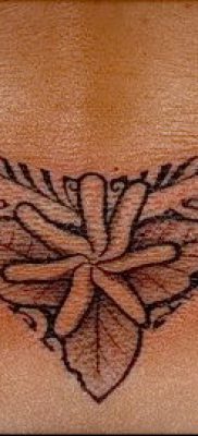 tetoválás a farokcsont fotóján (érték) - példa egy érdekes tetoválási rajzra - 017