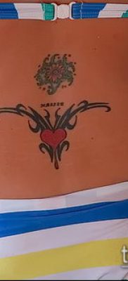 tetoválás a farokcsont fotóján (érték) - példa egy érdekes tetoválási rajzra - 016