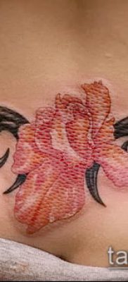 tetoválás a farokcsont fotóján (érték) - példa egy érdekes tetoválási rajzra - 014