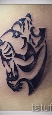 fotó egy tigris vigyoros tetoválásról egy cikkre a vigyortetoválás jelentéséről - tatufoto.ru - 1