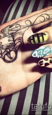 Fotó egy revolver tetoválásról (jelentése) - példa egy érdekes tetoválási rajzra - 017