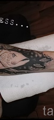 Снимка на татуировка на щука - красива татуировка на предмишницата на мъж