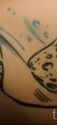 Fényképes példa egy csípős tetoválásról 11